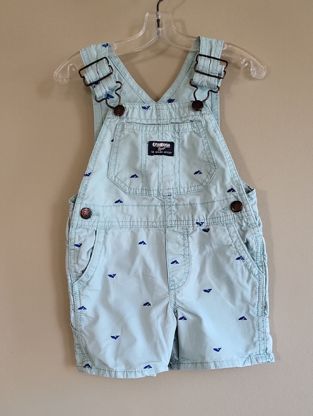 OshKosh B'gosh light blue shortall  with embrodiered whales.